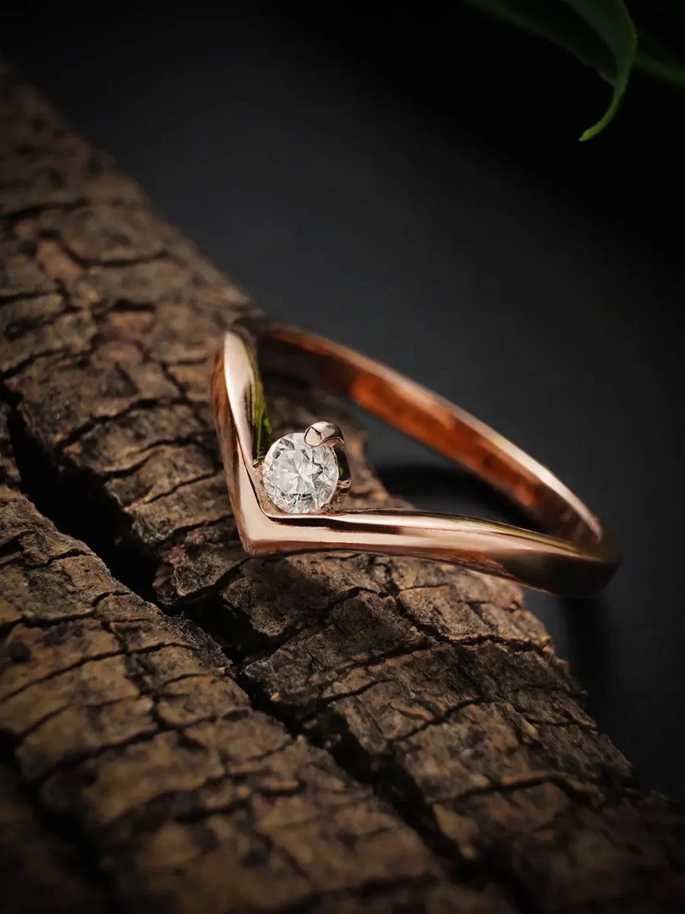 Twist of destiny moissanite diamond ring on a textured background