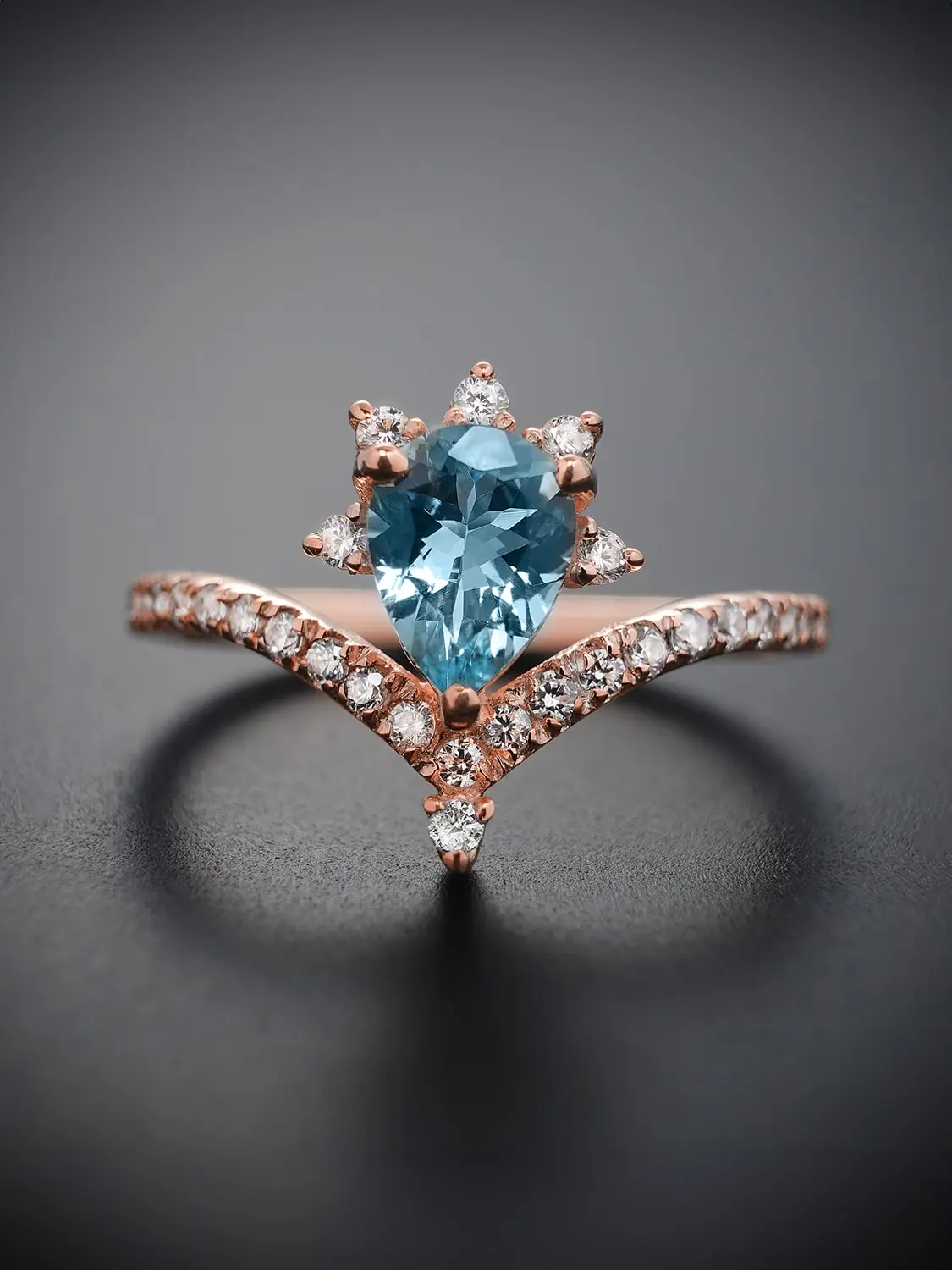 Elegant minimalist blue topaz ring on a rose gold band