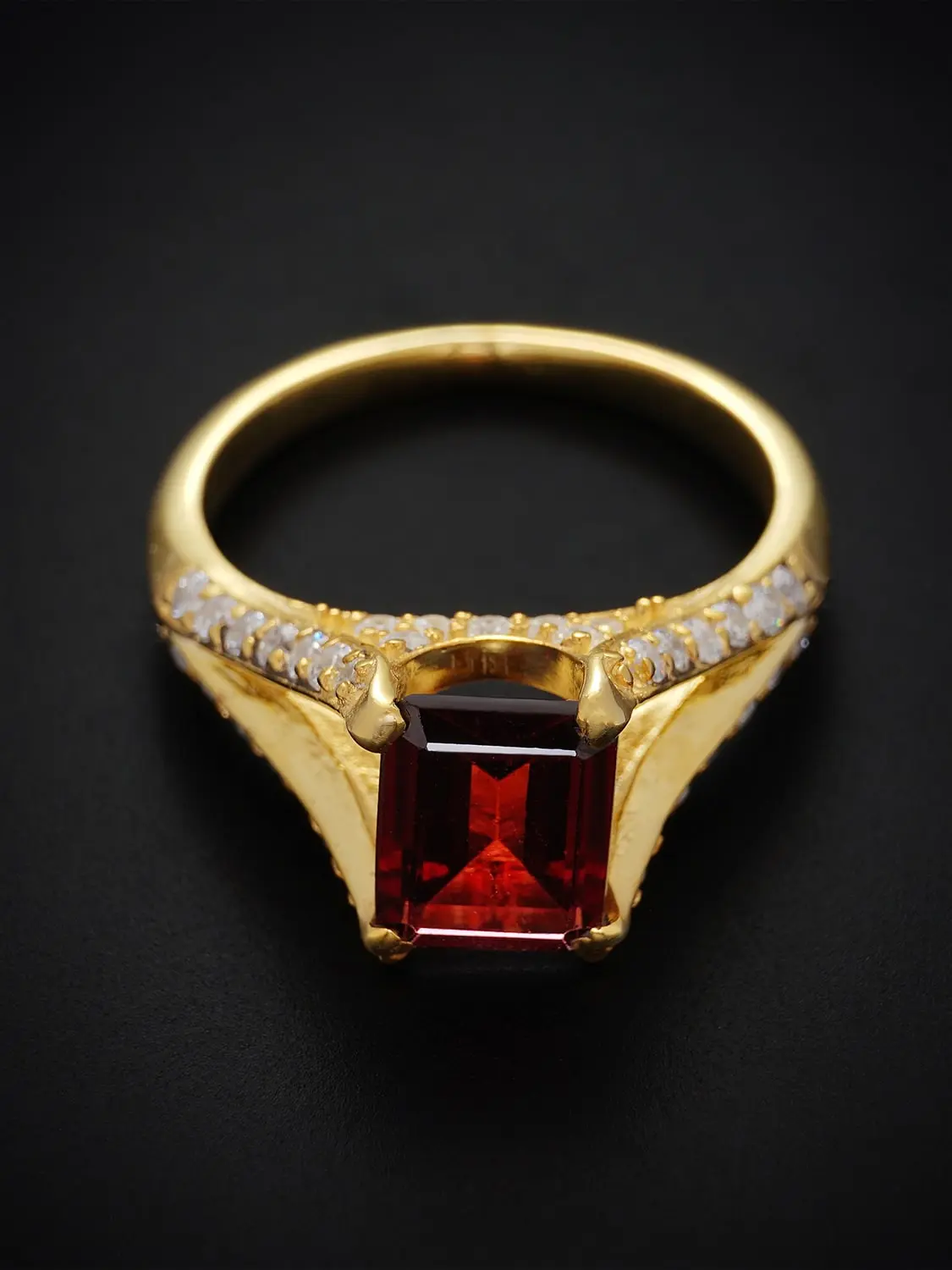 Luxurious red garnet and moissanite diamond ring in split shank setting