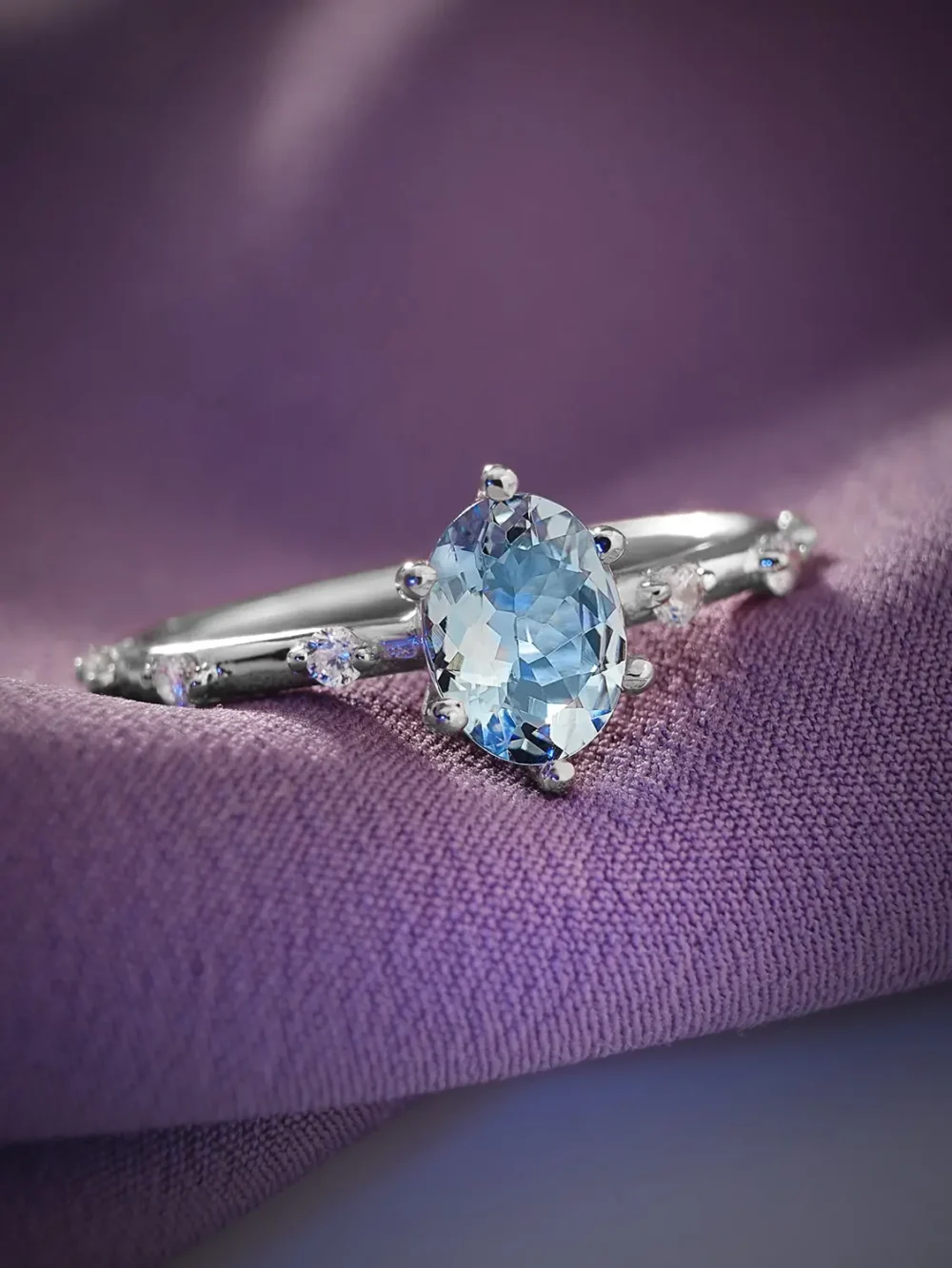 Blue topaz & moissanite minimalist band ring on a soft background