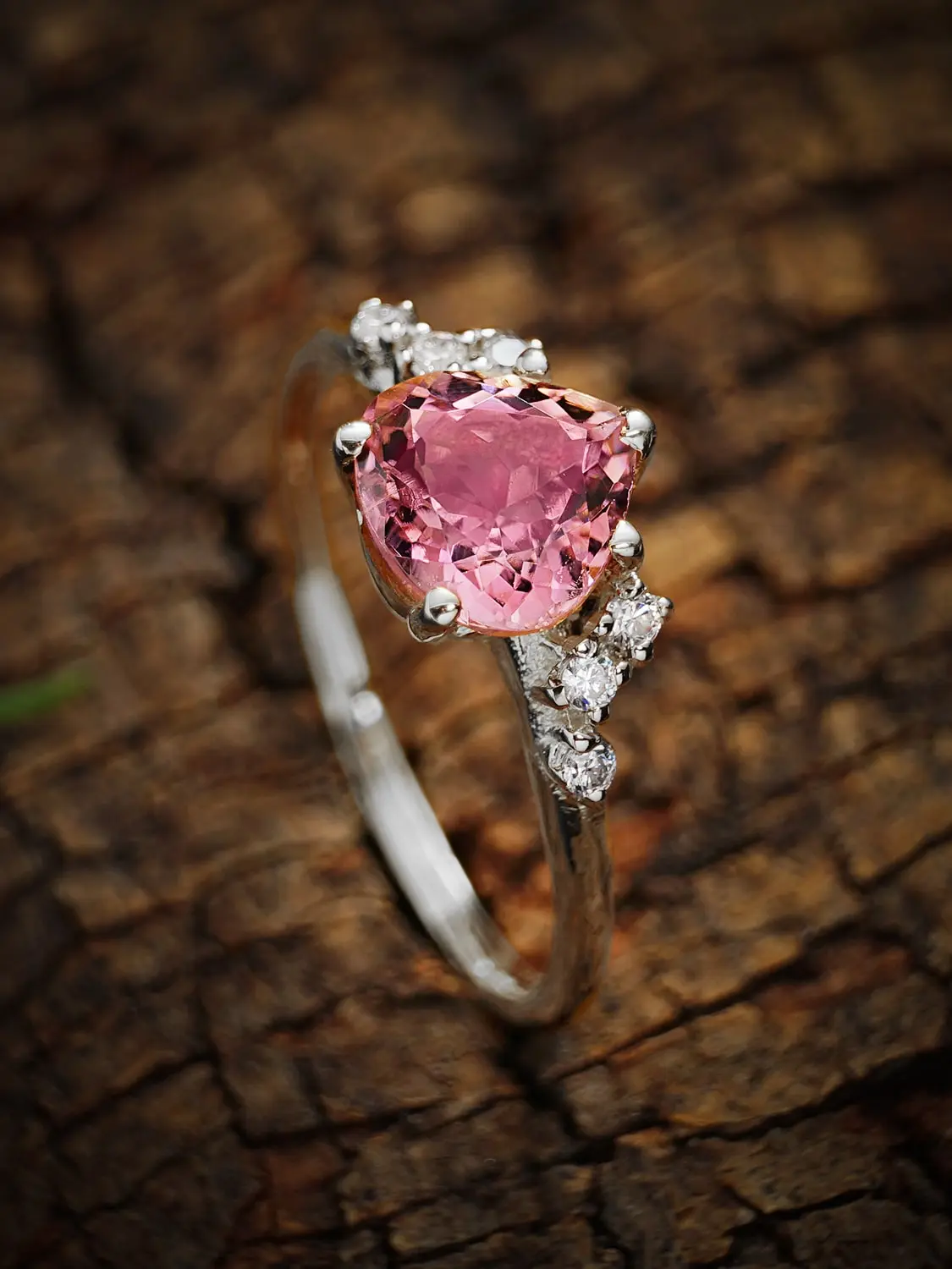 Elegant pink tourmaline heart ring with moissanite accents in sterling silver