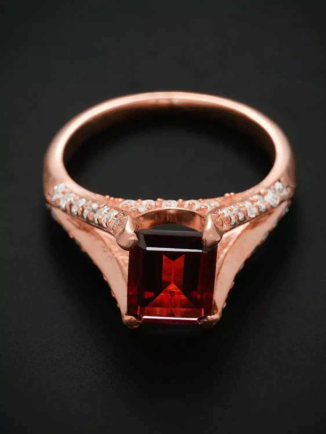 Luxurious red garnet and moissanite diamond ring in split shank setting