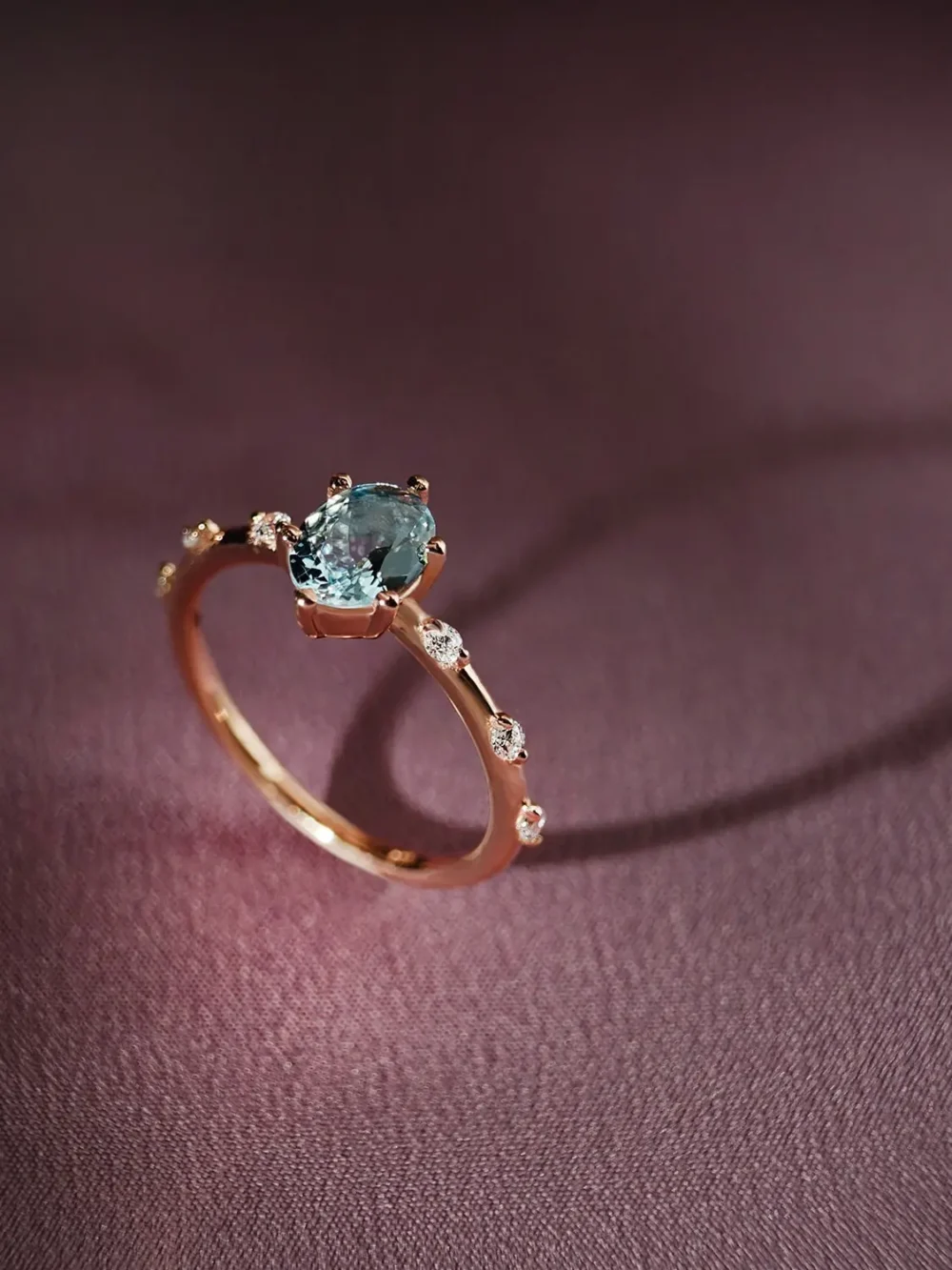 Blue topaz & moissanite minimalist band ring on a soft background