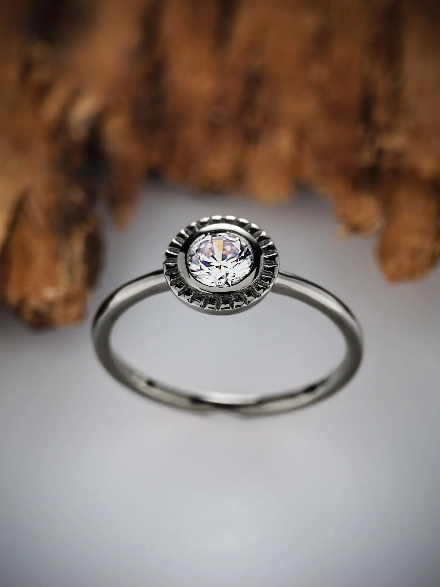 Classic floral moissanite solitaire ring in elegant setting