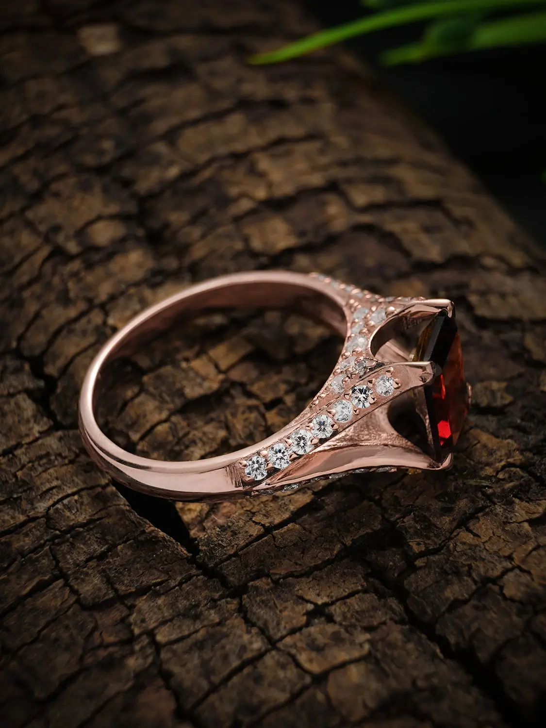 Crimson majesty garnet ring on a wooden backdrop