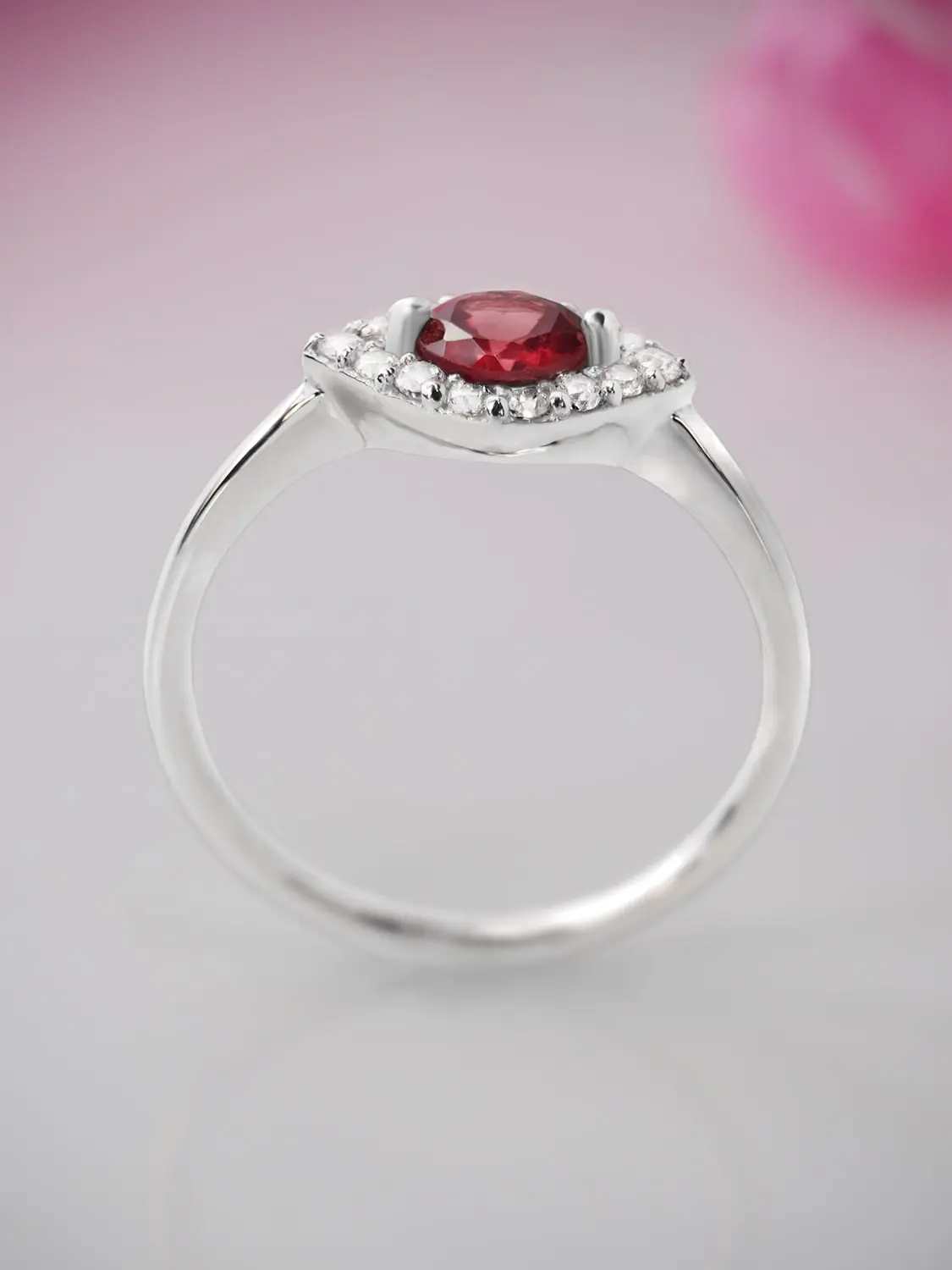 Red garnet ring with moissanite accents in white gold