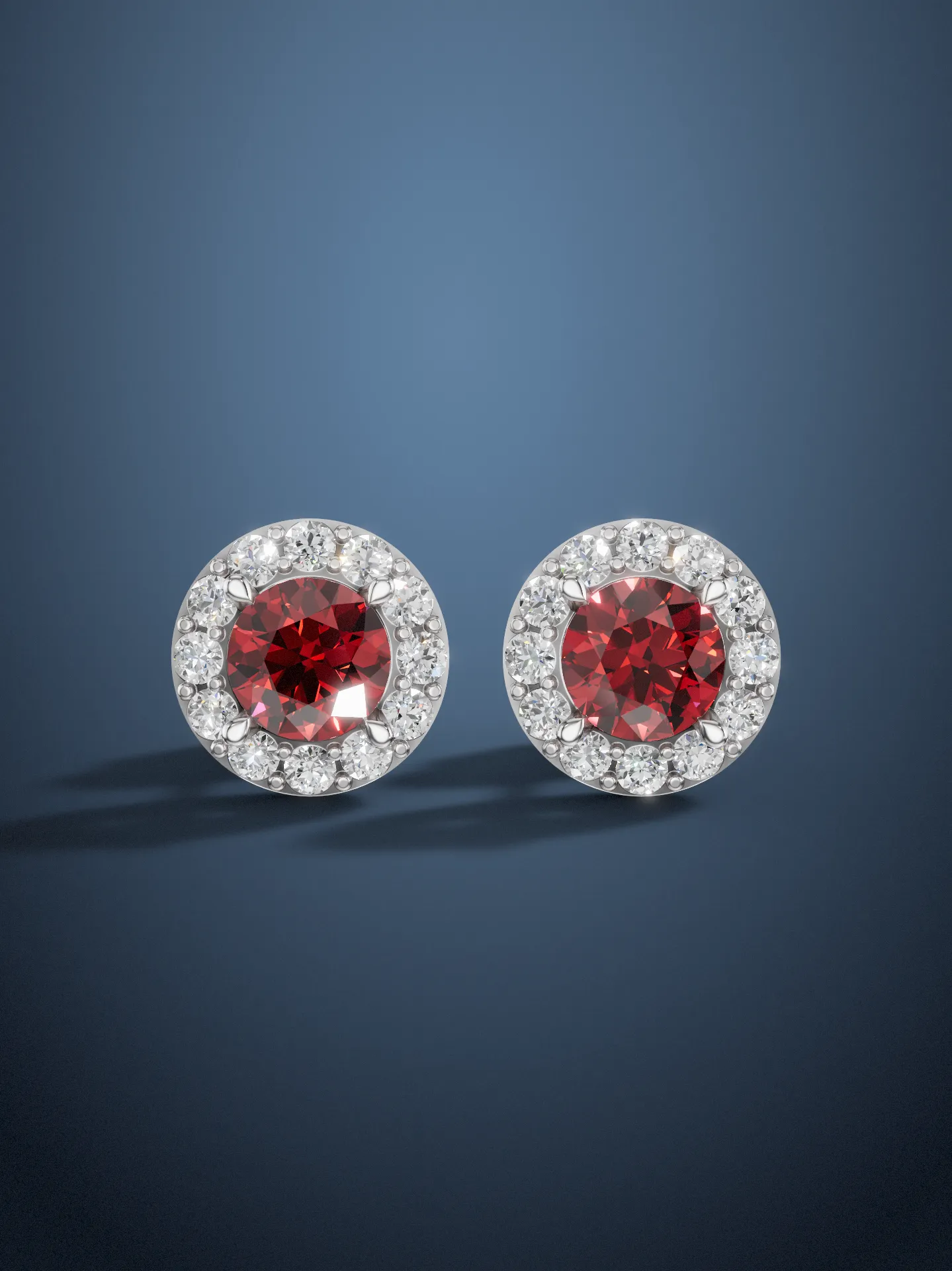Ruby halo stud earrings front view