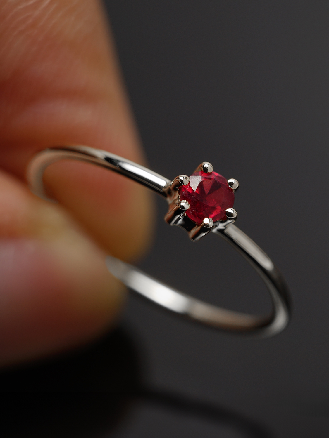 Close-up of 4mm Ruby Solitaire Ring in Sterling Silver