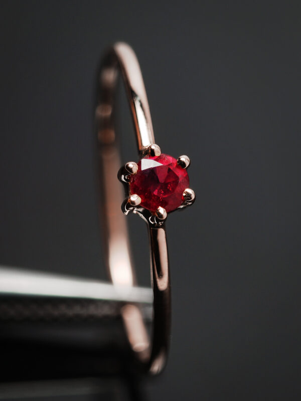 Elegant Ruby Solitaire Ring Close-up with Rose Gold Plating